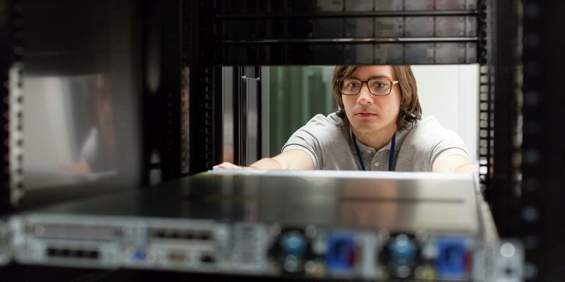 Man working in a data center.